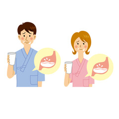 バリウムを飲む苦い顔をする男女