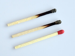 Burnt and fresh match sticks. Concept of social distancing during Covid 19 pandemic