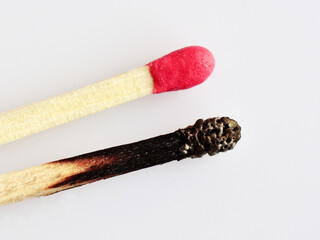 Fresh and burnt match sticks. Concept of social distancing during Covid 19 pandemic