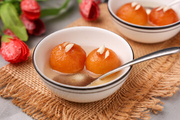 Indian sweet food Gulab jamun , gulaab jamun, jam Egyptian Zalabia balls dessert mithai freshly fried  in sugar syrup or sprinkled with powdered sugar. Prepare use milk solids on Ramadan, Diwali India