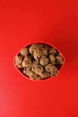 Indian traditional snack spicy Pakoda on Red background	
