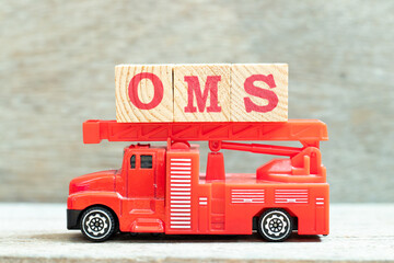 Fire ladder truck hold letter block in word OMS (Abbreviation of Order management system or...