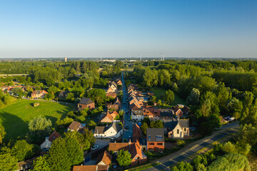 Aerial view of the Flemish village of Vlassenbroek, near Dendermonde, on a warm summer evening