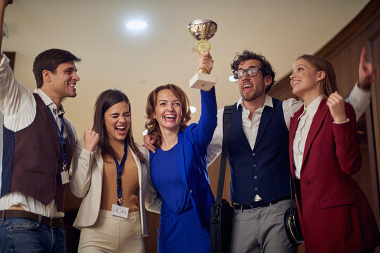 Business Team Celebrating Together Success, Holding Trophy