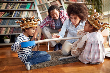 The mother take care that children do not hurt each other while playing. Family, together, love, playtime