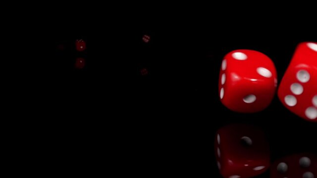 Dice dropping and bouncing in slow motion. Сlose-up.