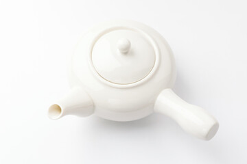 Porcelain teapot on white background