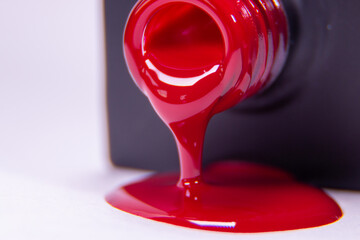 red nail polish pouring into glass A pack of red 