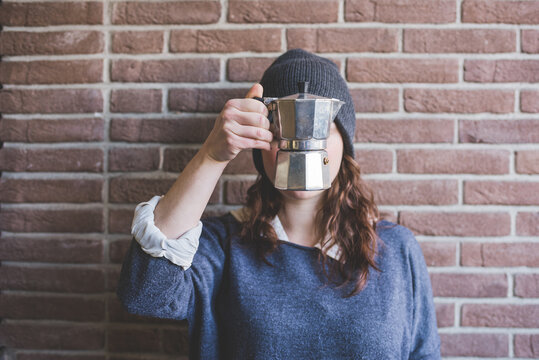 Young Millennial Woman Posing Showing Moka Pot