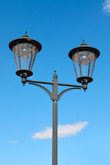 Fototapeta na wymiar Vintage street lamp isolated against blue sky
