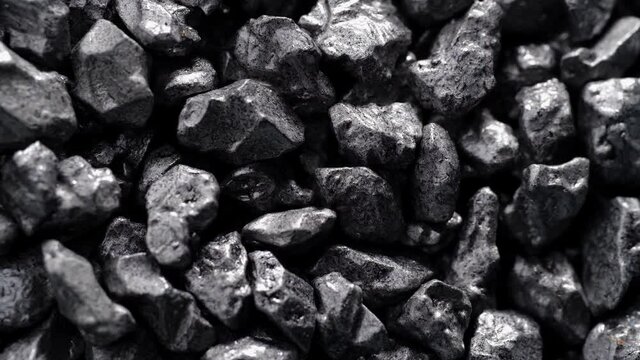 Stone ore close-up. Black stones grunge background.