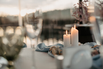 Luxury romantic candlelight dinner table setup for couple in ocean view restaurant on Valentine or...