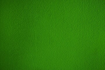 Obraz premium Plain green textured dark to light gradient background. Kelly green color backdrop. Bold green colour material with grunge style design. Blank surface with space for text, copy space, image. 