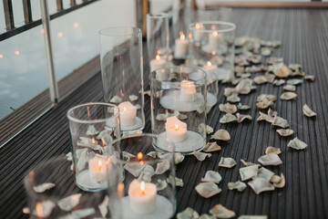 Valentines dinner romantic love concept / Luxury Romantic table setting decorated with  couple wine glass,  flowers with candlelight on table dinner night light background 