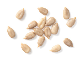 close up of peeled sunflower seeds isolated on white background, top view