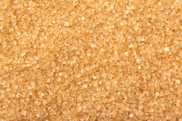 food background of yellow sanding sugar, full frame, top view