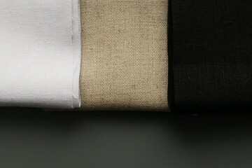 rolls of linen fabric of different colors