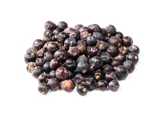 handful of dried juniper berries closeup on white