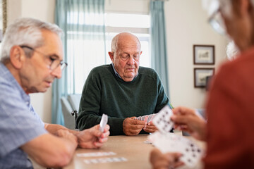 Senior people playing cards