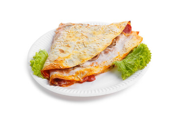 Frozen pancakes stuffed with meat on plate.