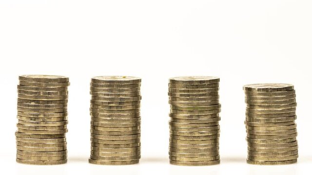 4K Stop motion shows the stack of three piles of gold cash coins decreasing and increase fading at white background, business and financial trading 
concept idea.
