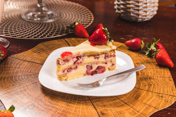 Perfect Strawberry Cake Slice on a Wooden Table High Res