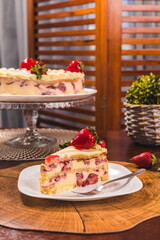 Perfect Strawberry Cake Slice on a Wooden Table High Res