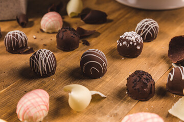 Various Chocolate Sweeties and Dessert on a Wooden Table