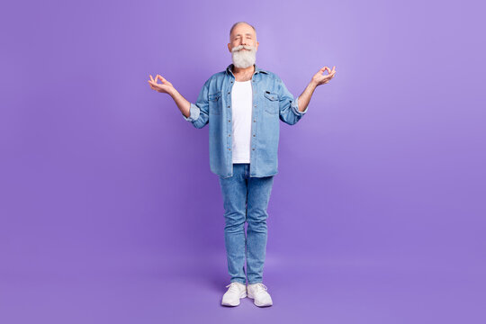Full size photo of aged man happy positive smile meditate yoga zen om calm isolated over purple color background