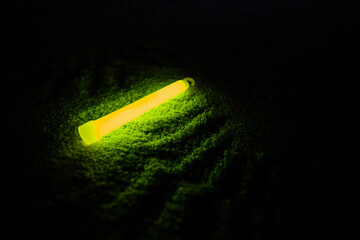 Yellow glowing stick with chemical light.