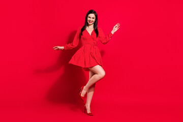 Full size photo of impressed brunette lady dance wear red dress shoes isolated on vivid color...