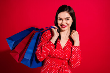Photo of lovely brunette lady touch hair do shopping wear red dress isolated on vivid color background