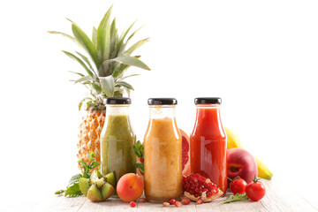 fruit juice in bottle and fresh fruits
