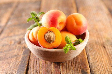 bowl with apricot and leaf