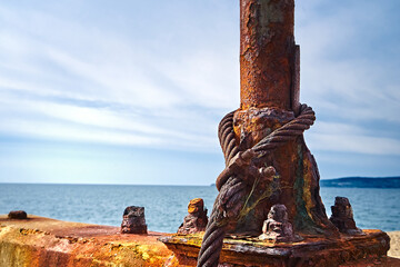 Corrosion of metal. Rusty bollard.