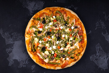 Top view of delicious and crispy pizza. American or Italian pizza. Cooking background concept.