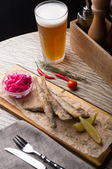 Fried fish with lemon as snack for beer