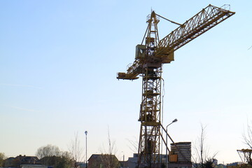 Tower cranes are working on the construction of a new house. Lifting crane.