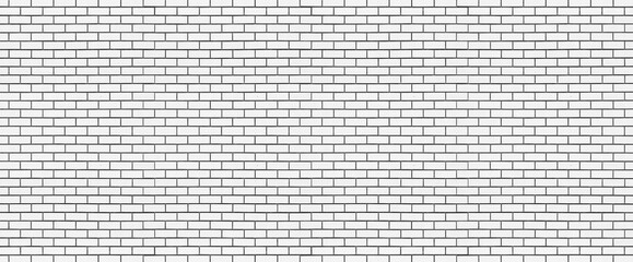 Long brick wall of light gray bricks. Abstract background for design. Backdrop for text. Copy space. Panorama.