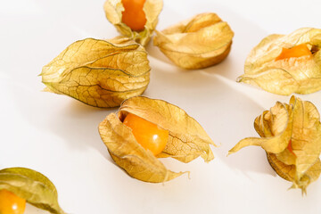 bright juicy yellow physalis berries close-up on a white background