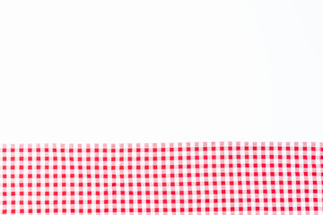 Fabric red and white crumpled isolate on white background. Tablecloth checkers top views with copy space for text.