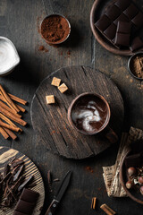 Hot chocolate in a cup on wooden background