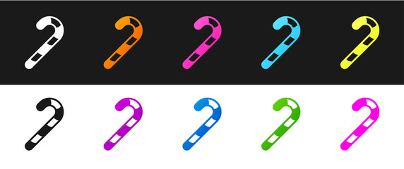 Set Christmas candy cane with stripes icon isolated on black and white background. Happy Halloween party. Vector