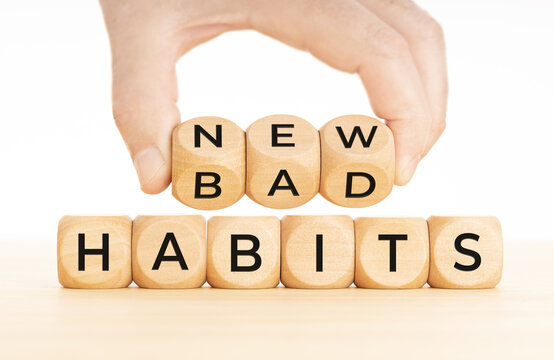 From Bad to new habits concept. Hand turns a wooden blocks with bad to new words