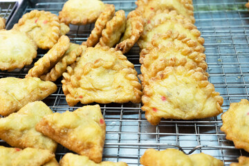 deep fried puff pockets, yau gok. Traditional Chinese New Year snack eating during celebration season