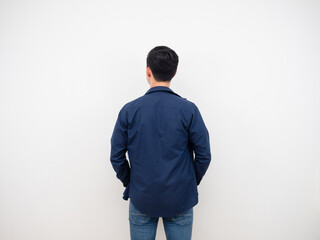 Handsome man back view in jean suit standing at studio white background