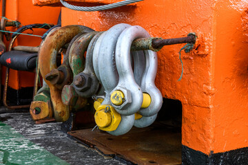 Big steel shackles on offshore supply vessel. Towing equipment.