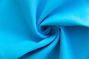 Dense light blue fabric coiled texture