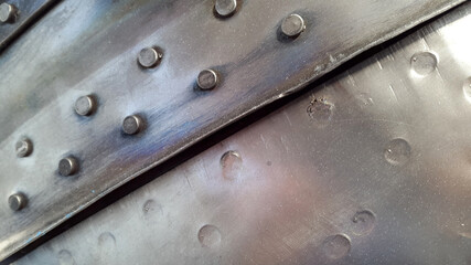 Studded metal surface. Industrial vintage background