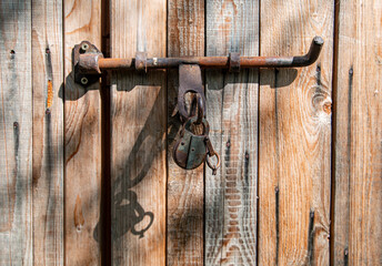 Old door lock on the barn door 